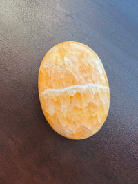Orange Calcite Palm intuitively pick